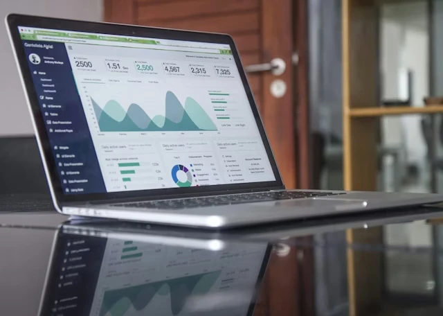 Laptop displaying an analytics dashboard with traffic charts